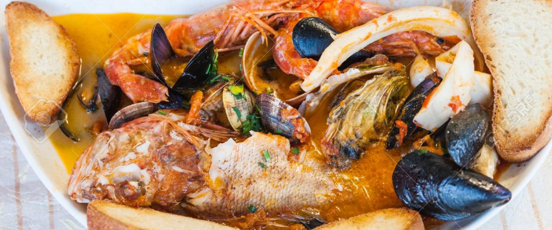 Special fish dinner at typical restaurant in the historical center of Sirolo Special fish dinner at typical restaurant in the historical center of Sirolo